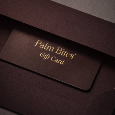Palm Bites gift card in a brown envelope on a dark background