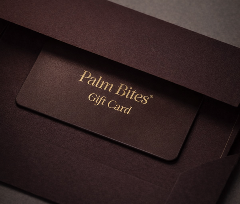Palm Bites gift card in a brown envelope on a dark background